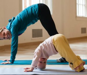 Mom and Daughter Doing Yoga