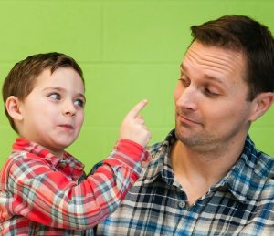 Boy Making Face at Dad