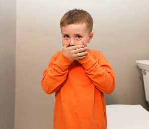 Boy Covering Mouth