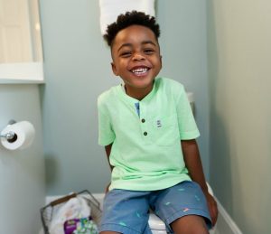 Smiling boy on potty