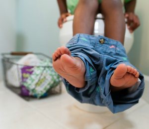 Boy's Feet Dangling From Potty