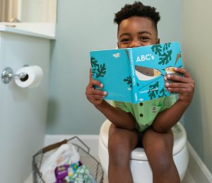 Boy Reading on Potty