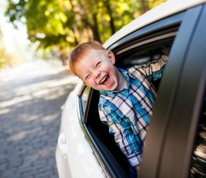Kid Sticking Head Out of Car Window