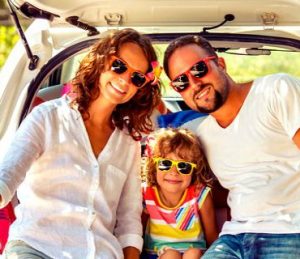 Family in back of car